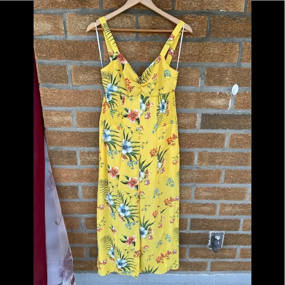 Likely yellow floral jumpsuit size 10